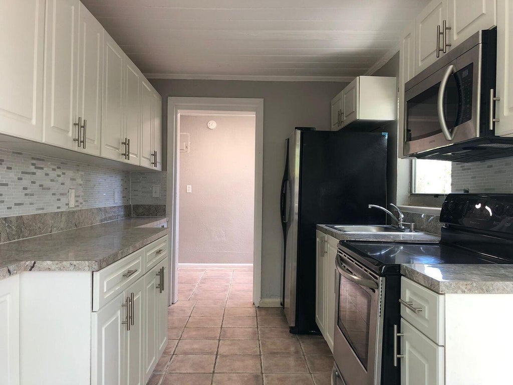 Photo of 1069 W 30TH Street #6, Riviera Beach, FL 33404 (MLS # B26072811)