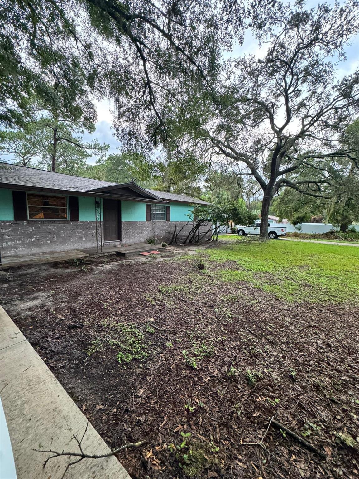 Welcome Home. Freshly painted interior, New luxury vinyl flooring in the living spaces and laminate in the wet areas and New Roof(2025) in this 3 bedroom 2 full bath Concrete Block Home with 1,127 living sqft under roof. Inside Laundry Room, screened patio and extra deck space for BBQ.This property sits on 0.52 acres lot, NO HOA, so bring your Boat or RV. Pet Friendly, FIRSt, LAST & One Month Damage Deposit, Clean Background Check & Eviction Record.Come check this one soon!