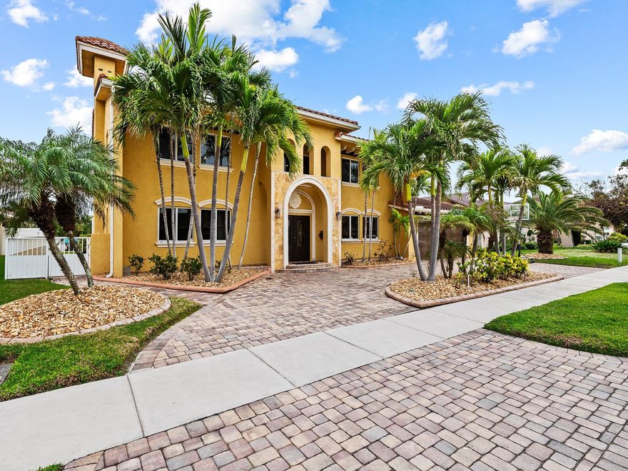 Experience luxurious costal living in this stunning Mediterranean style estate in Deerfield Beach.  Just off the Intracoastal Waterway, this over 4000 sq ft home offers 5 spacious bedrooms including private Mother-in-law suite ideal for guests or extended family plus a large office (which could be a 6th bedroom) Designed for elegance and comfort , the home features custom finishes with a huge eat in kitchen with family room.  Seamless indoor-outdoor flow.  Lush landscaping, resort style outdoor space make this a true South Florida sanctuary.  Ideal for boaters and entertainers alike, Enjoy waterfront living with easy access to both Hillsboro and Boca inlets! Easy access to Boca’s Mizner Park.  You can walk or golf cart to the beach, shopping and restaurants. Location! Location! Location!
