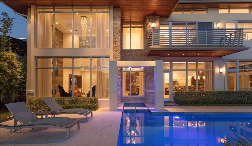 Stunning Modern Architecture enlivens this recently built LAS OLAS Waterfront Estate. The Home lives more like a RESORT with 5BRs/6.2 BA plus a FULL GUEST APT with Summer Poolside Bar/Entertainment area. Huge Open Kitchen with Great room, Living and Dining, all overlooking a 150’ wide canal on a 103’ WF.  Master suite with Huge Bath/Closets.Fresh and functional design, Luxurious Finishes, Control 4, Sub-Zero, Wolf, home theater, fireplaces, so much more. Steps to Las Olas shopping/dining. OVER 9000 TSF
