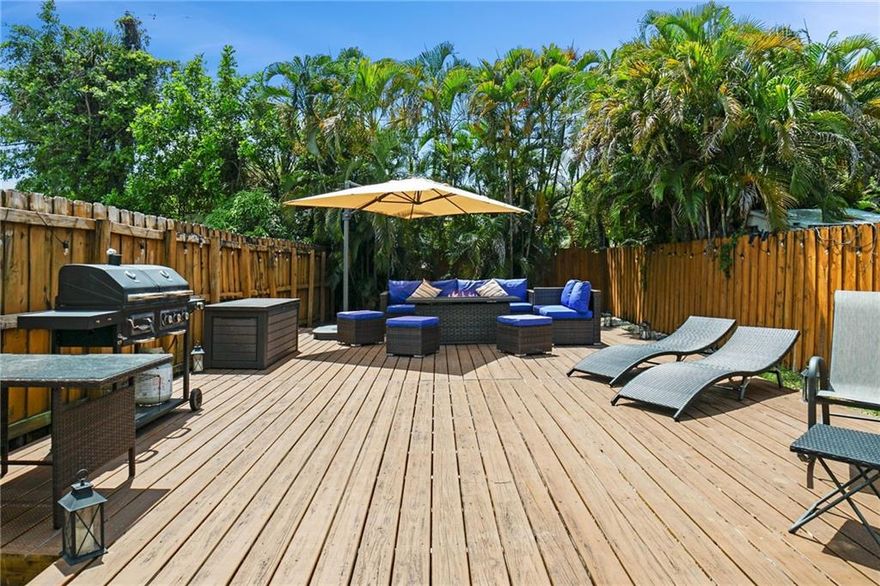 No condo or HOA fees! Fee simple 3 bedroom, 2.5 bathroom east Fort Lauderdale townhouse with its own private garage and backyard a few doors away from bars and restaurants on NE 13th Street, minutes from the action downtown, and super close to the beach. Large living room with 10 foot high ceilings flow through on the ground level to the backyard space with large wood deck for entertaining. 2022 new air conditioner, 2023 water heater, 8 foot doors throughout. Located diagonally across the street from beautiful walking paths in lushly landscaped Middle River Terrace Park.