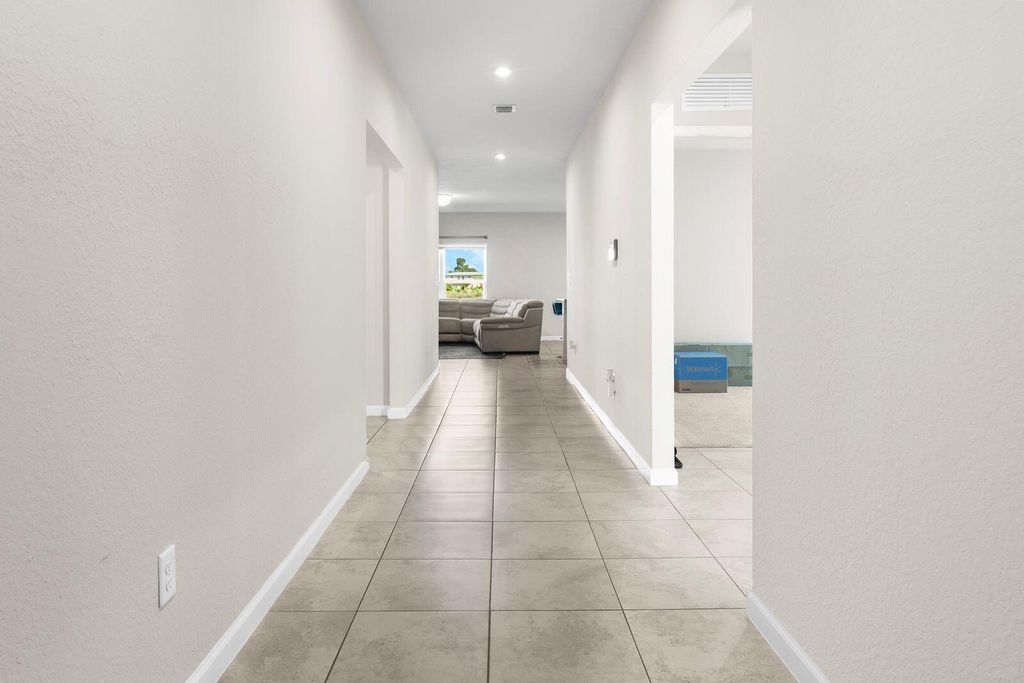 Photo of 185 Dabou Loop, Belle Glade, FL 33430 (MLS # R11146033)