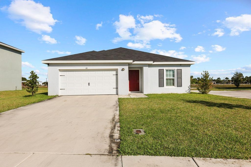 Photo of 185 Dabou Loop, Belle Glade, FL 33430 (MLS # R11146033)