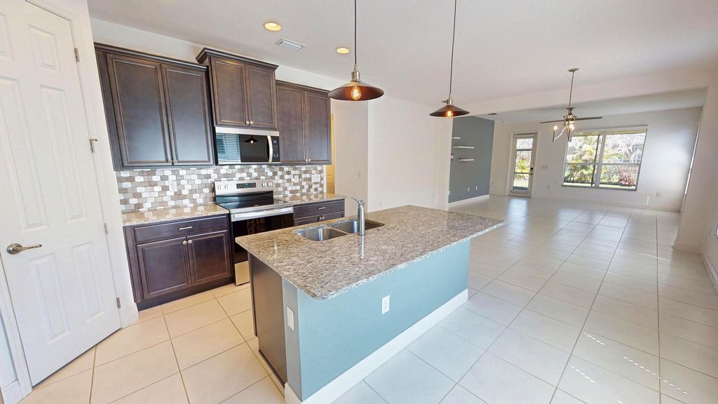 Photo of 9828 SW Trumpet Tree Circle, Port Saint Lucie, FL 34987 (MLS # B26022666)