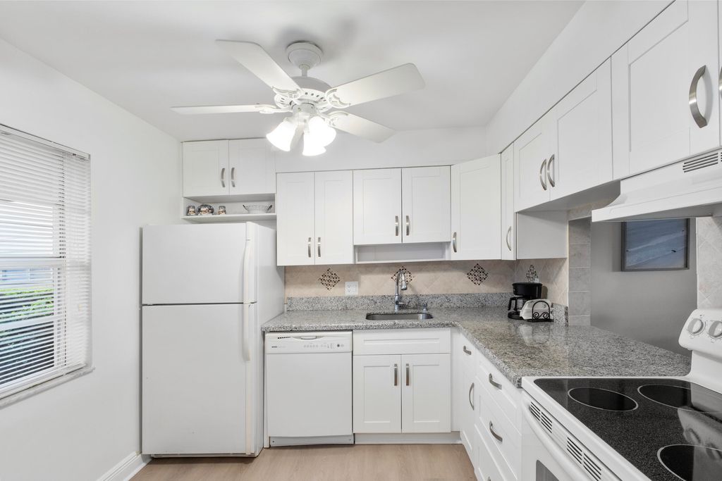 Photo of 20 Abbey Lane #102, Delray Beach, FL 33446 (MLS # B26015351)