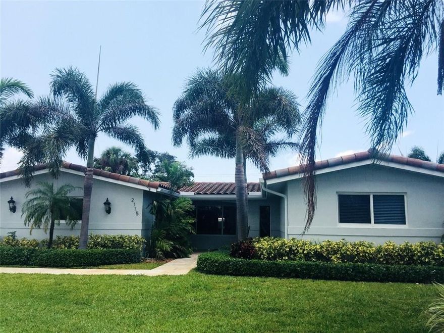 This gorgeous home sits on over 1/4 acre corner lot. Renovated from head to toe: stunning granite kitchen with center island, IMPACT WINDOWS, newer roof, new A/C, heated salt water pool, extensive covered lanai with built-in summer kitchen and bar, custom cabinetry, marble and wood floors throughout, separate laundry room, TWO CAR GARAGE, 3 BEDS and 3 FULL BATHS, separate living and family rooms. Owner to include 60" built-in TV and Bose surround sound 5-speaker system. HURRY!  THIS GEM WON'T LAST!!