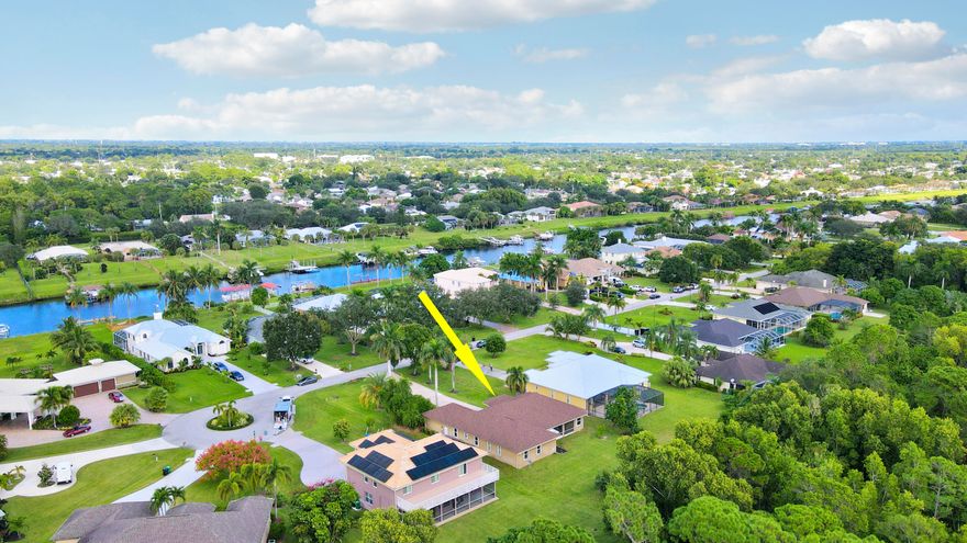 Store your Boat/trailer and other Toys on this .59ac lot in the quant community of Osprey Ridge which has only 34 custom-built homes. This 4 bedroom, 3 ½ bath offers a Gourmet Kitchen, double wall oven, wooden 42'' cabinets with granite counters and a large walk-in pantry. Wet bar and wine fridge just off the dining room leading into the family room. Primary Suite includes California walk in closets, bath with dual sinks and huge wrap around counter with a spacious walk-in shower. Large, screened patio with cabana bathroom and room for a pool. Recent upgrades are a brand-new roof and full accordion shutters in 2021. The neighborhood (with Low HOA fees) runs along the St Lucie C-24 canal with Ocean Access and public boat ramp just across the street!