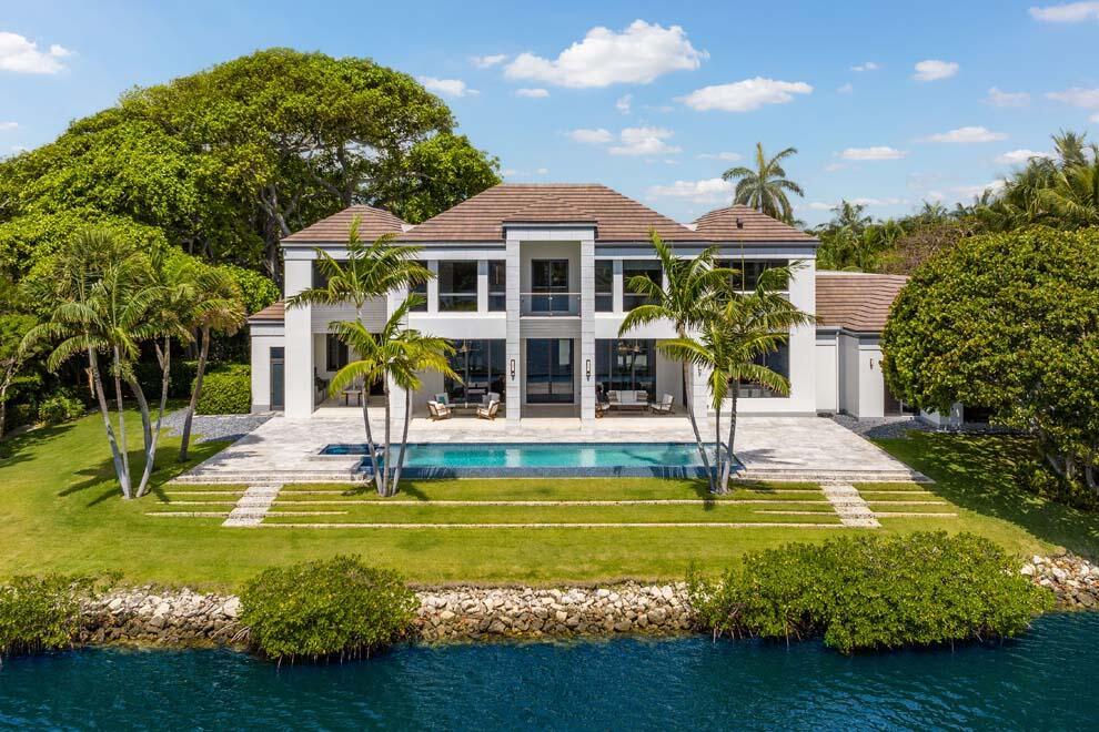 Introducing 1540 Paslay Place, a stunning, like-new estate located in one of the most sought-after locations in south Florida; Manalapan, FL. Located at the end of a private cul-de-sac, this elegant, contemporary masterpiece was built and designed by Cudmore Builders and Randall Stofft Architects. Boasting over 180' of waterfrontage and over 10,000 total square feet, this 5-bedroom home offers a spacious, open floor plan that seamlessly integrates indoor/outdoor living, soaring ceilings and breathtaking views. Highlights include outdoor lounging and dining areas, expansive saltwater pool and spa, Miele and Thermador appliances, club room, library, office, media room, elevator, summer kitchen and 4-car garage. Do not miss the opportunity to own one of the most amazing homes in S. Florida.