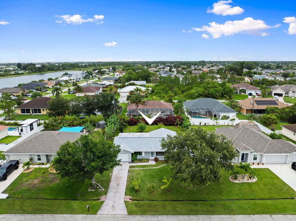 Photo of 2455 SW Datura Avenue, Port Saint Lucie, FL 34953 (MLS # R11097673)