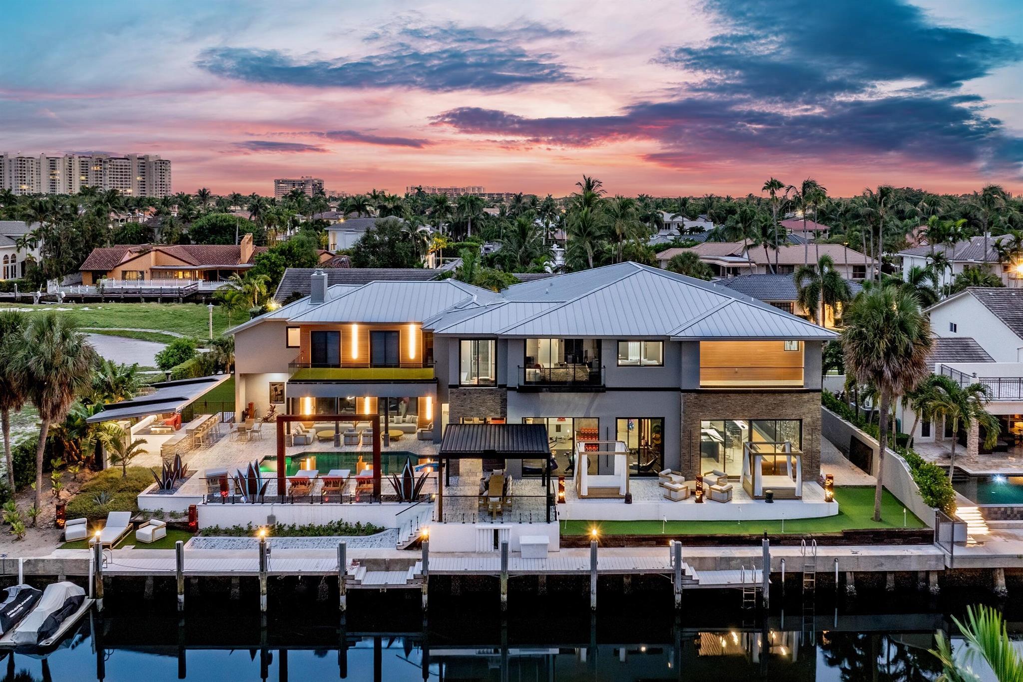 Discover 839 NE Bay Isle Drive, a newly built contemporary masterpiece in Boca Bay Colony. Spanning over 9,000 square feet on an oversized lot with 135 feet of deepwater frontage, this estate offers direct ocean access in minutes. Offered Fully furnished with bespoke custom furniture, this 6-bedroom, 8-bathroom residence redefines luxury waterfront living. Powered by natural gas with a tankless water heater, it blends cutting-edge technology and curated finishes for unparalleled sophistication. Enter through a glass pivot door into the Great Room, where soaring ceilings, 42'' x 42'' porcelain floors, and pool deck views captivate. The chef's kitchen boasts a Viking gas cooktop, Thermador oven, GE double oven, JennAir dishwasher, Kenmore refrigerator, and a walk-in pantry with a Samsung