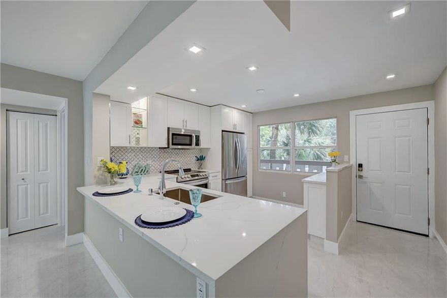 NEW PRICE!..ABSOLUTELY STUNNING!.AMAZING OPPORTUNITY TO GET THIS COMPLETELY RENOVATED TOP OF LINE 2 BEDROOM/2BATH. HIGH IMPACT WINDOWS THROUGH-OUT. BRAND NEW OPEN KITCHEN CONCEPT WITH WHITE QUARTZ COUNTER TOPS + SELF CLOSED CABINETS AND DRAWERS. BEAUTIFUL PORCELAIN FLOORS THROUGH-OUT. TOTALLY RENOVATED BATHROOMS WITH NEW MODERN AND LUXURIOUS LOOKING SHOWERS AND VANITIES. SMOOTH CEILINGS WITH EXTRA LIGHTING. BRAND NEW ELECTRICAL PANEL AND ALL NEW ELECTRICAL WIRE AROUND THE APT. THIS IS A MUST SEE!. ASSOC REQUIRES 20% DOWN & 1 OCCUP 55+ VACANT/CLICK ON SHOWING ASSIST