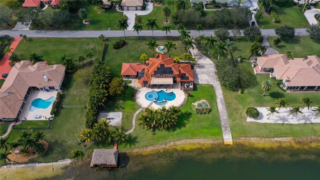 Photo of 5660 Lago Del Sol Drive, Lake Worth, FL 33449 (MLS # F10556424)