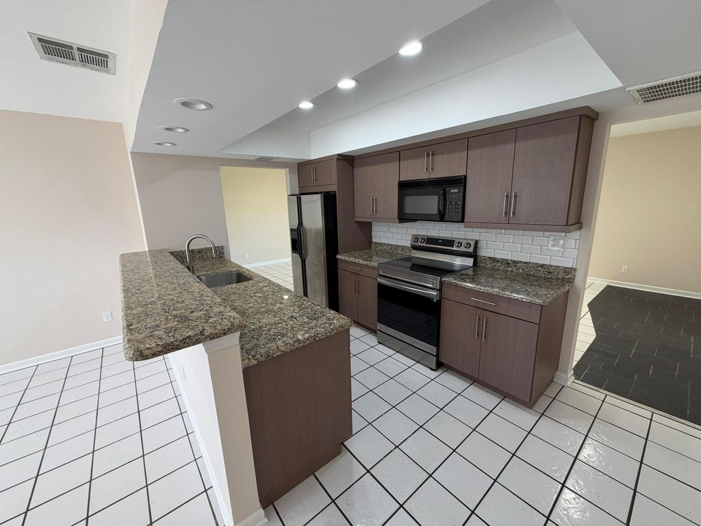 Photo of 499 W Conference Drive, Boca Raton, FL 33486 (MLS # B26036694)