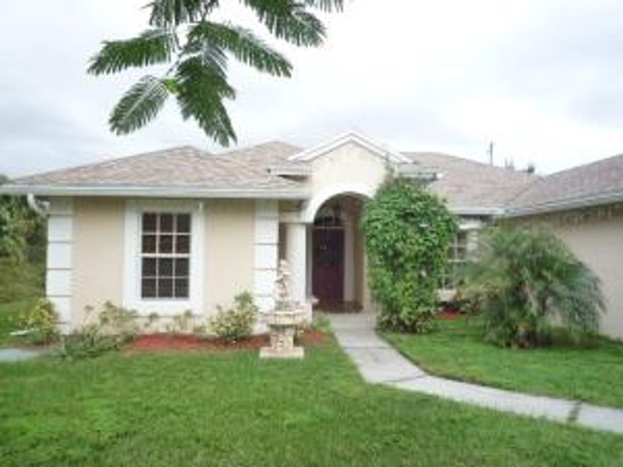 Accepting Back-Up Offers only.  Clean, Bright and Beautiful . . .  This home shows pride of ownership inside and out!  Gorgeous CBS open layout split plan offers 3 bedroom 2 baths and a 2 car garage built in 2007.  Home features large covered front entry way and patio with decorative columns adding to the visual appeal.  Interior includes tile throughout each room; vaulted ceilings; bay window with seating; upgraded lighting and ceiling fans.  The open and airy living room includes beautiful custom window coverings over the large glass sliders which allow for easy access to the spacious tiled and screened back patio.  The Kitchen includes upgraded stainless steel refrigerator and microwave as well as a black range. The Utility room, which is situated adjacent to the kitchen, includes a washer and dryer and access to the Garage/storage area.  Master Bedroom is tiled and boasts coffered ceilings and an extra-large walk in closet.  Enjoy the outside with your own piece of paradise which includes an over sized yard with Tropical landscaping that is meticulously kept.  NOTE:  Buyer(s) agree Property to be used as Buyer(s) primary residence and agree to sign affidavit or addendum attesting to occupancy for up to 2 years after purchase.    Water fountain in front lawn does not convey.