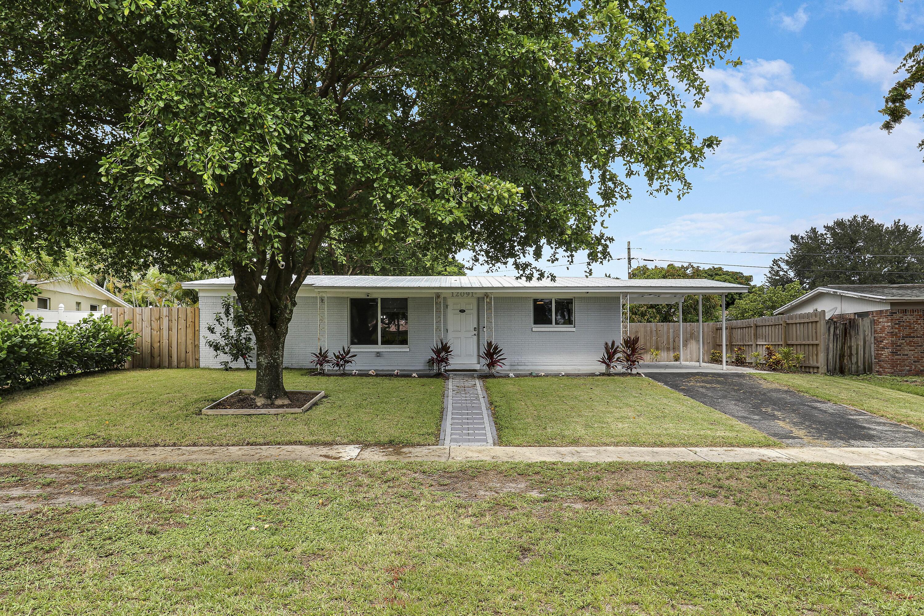 Complete first-class renovation in prime location. Extraordinary like new home located in Palm Beach Gardens close to the Gardens Mall, fine dining and entertainment, and just a short ride to the beach and freeway access. No HOA governing bodies! This beautiful home has all new impact windows and doors, a new metal roof, a new open concept kitchen, all new stainless steel kitchen appliances, and new bathrooms. There is also great curb appeal and distinctive new landscaping. As you walk in you experience a split floor plan with separated living room and Florida room. New high capacity washer and dryer and a new utility room with Ecosmart tankless water heater. All new irrigation system installed with programmable control box. See it today before it is too late.