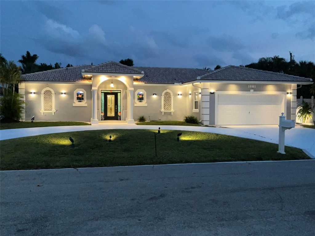 Photo of 1061 Bimini Lane, Riviera Beach, FL 33404 (MLS # F10447515)