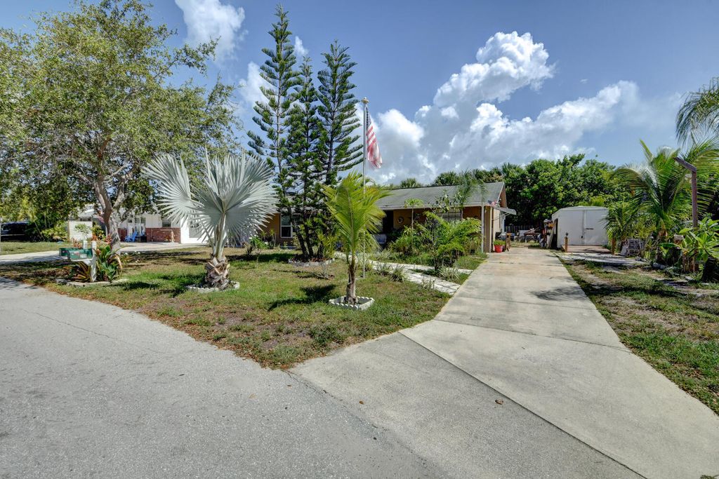 Photo of 2116 NE Rustic Place Pl, Jensen Beach, FL 34957 (MLS # R10817766)