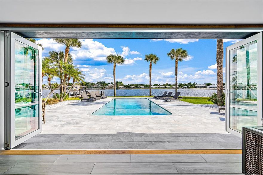 Hidden Key masterpiece with 180 feet of waterfrontage and wide water views to Lost Tree Village, this property has been totally renovated with impeccable finishes. Features such as granite mined under water in New Zealand, centuries old white oak and tin imported from Edgar Allan Poe's ''Bleak House Manor'' are a few items that make this house so unique. One of the largest lots in the community, plus SE exposure, make the outdoor living spaces even better with over 1,000sqft walk out balcony, marble pavers, spacious lawn, and an outdoor bar. All new seawall, dock with 20,000LB lift, and only 15 minutes to the ocean by boat make this the best of South FL!