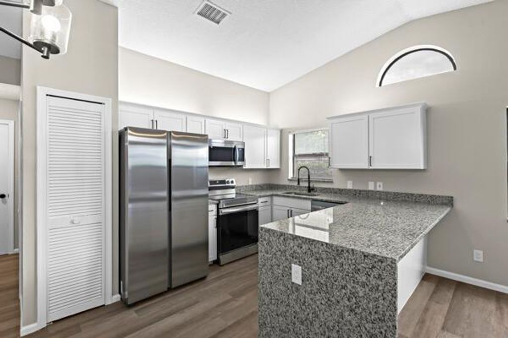 Photo of 147 Parkwood Drive, Royal Palm Beach, FL 33411 (MLS # R10991040)