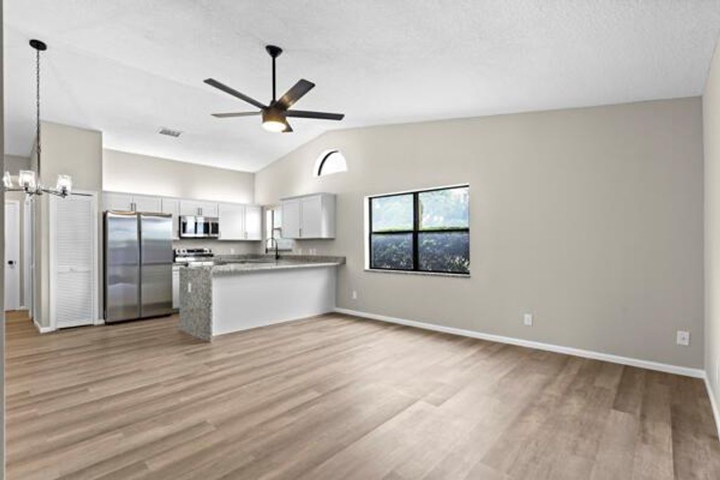 Photo of 147 Parkwood Drive, Royal Palm Beach, FL 33411 (MLS # R10991040)