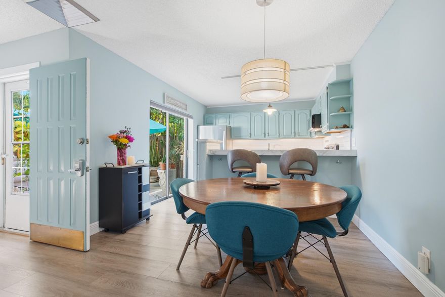 Pristine move-in ready! This 2BR/2.5BA townhome in Stuart's River Pines offers total peace of mind with a new A/C, new water heater, insurable electrical panel, and a paid-in-full mansard assessment. Newly resealed flat roof 2024 (5 yr no leak Guarantee). The interior features a remodeled kitchen with newer appliances and backsplash, beautifully updated bathrooms, fresh paint, and new carpet. Relax in your exceptionally private courtyard with palm trees and a fountain, or enjoy the freshly painted patio and balcony. River Pines is an active, all-ages community featuring two heated pools, pickleball, tennis, and a kayak launch/storage on the Intracoastal. Low HOA fees include cable, lawn care, and exterior insurance. Located near I-95, shopping, and the water. (No rentals first 3 year