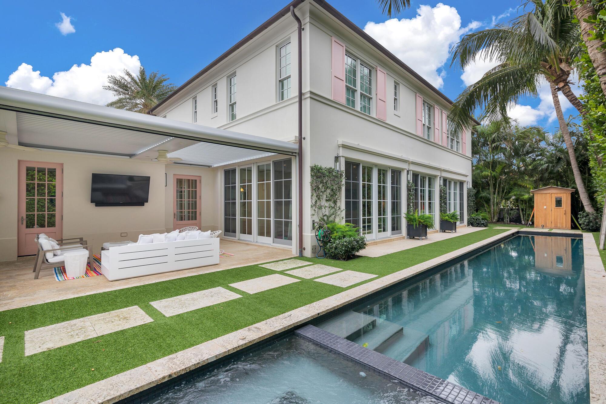 Stunning 5BR/5BA Bermuda Colonial home built in 2015 in fantastic, In-Town location. Just one block from the lake trail and the Atlantic Ocean. Highlights include light-filled living spaces, a gracious floorplan, and high ceilings. Chef's kitchen with Sub Zero and Thermador appliances, two dishwashers, and walk-in pantry. Spectacular outdoor spaces perfect for al-fresco dining and entertaining. Covered loggia with summer kitchen features unique automatic open/close roof system. Gorgeous tropical landscaping surrounds the 60-foot lap pool, spa/cold plunge, sauna, and mini basketball court. Second floor primary suite with spacious ensuite bathroom and dual walk-in closets. Additional features include air-conditioned 2-car garage, hardwood and limestone flooring, and full impact