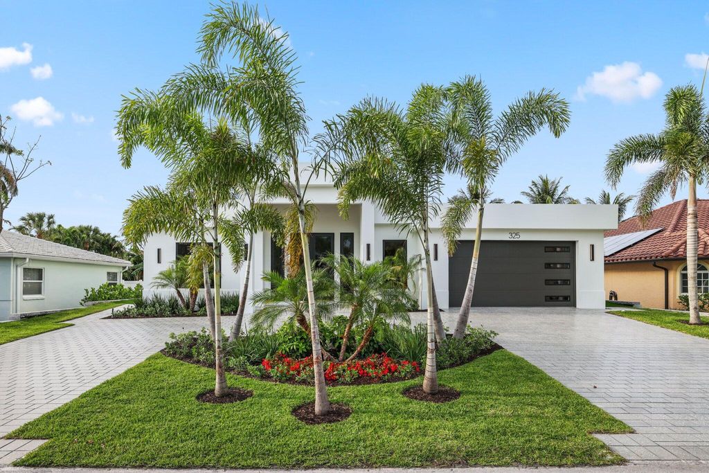 Photo of 325 Cascade Lane, Palm Beach Shores, FL 33404 (MLS # B26025479)