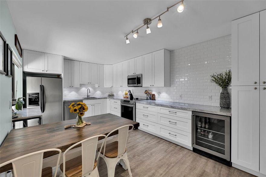 Beautifully remodeled townhome in Deerfield Beach with no expense spared! Cook & entertain in the gorgeous kitchen with white shaker cabinets, Quartzite counters, stainless appliances, wine fridge & designer hardware. Wood-like flooring throughout the 1st & 2nd floors. Large living room features sliders to patio, built in bookshelves with fireplace & flows into the dining area. Large Master Bedroom offers wood accent wall & custom walk-in closet with custom doors. Updated Master Bathroom has a walk-in shower & double vanity. Enjoy the private fenced patio, green space to run & play & community pool. Other updates include: new roof & fence, new inside & outside electrical, Hot Water Heater, new downstairs half bath, all the ceilings scraped & mature palm tree landscaping. Rent & pets ok