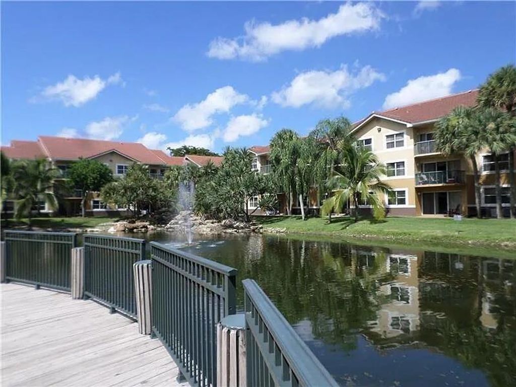 Photo of 8781 Wiles Road #203, Coral Springs, FL 33067 (MLS # R11165106)