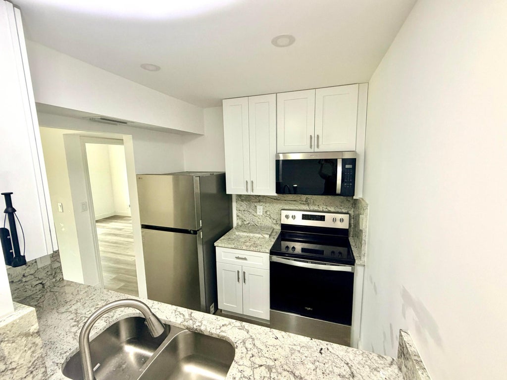 Photo of 1766 Abbey Road #105, West Palm Beach, FL 33415 (MLS # B26048133)