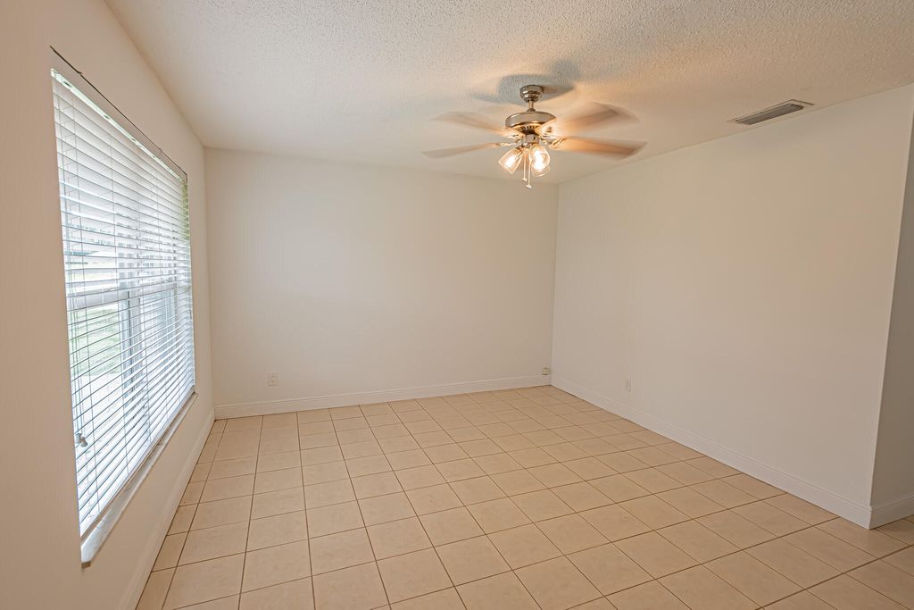 Photo of 1148 SE Puritan Lane, Port Saint Lucie, FL 34983 (MLS # R11164298)