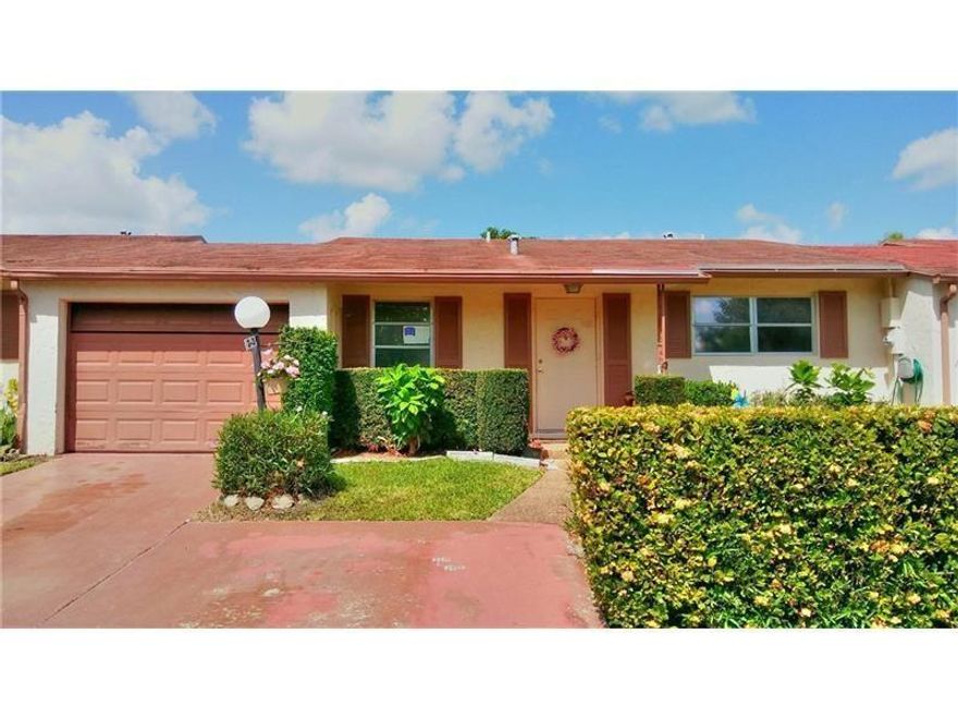 Attractive 2/2 villa - one car garage - Florida room - great golf view!  All tile floors - new kitchen - new appliances, including washer and dryer - Very low maintenance includes water! One person must be 55+ - Owner motivated!Please show and sell!!!