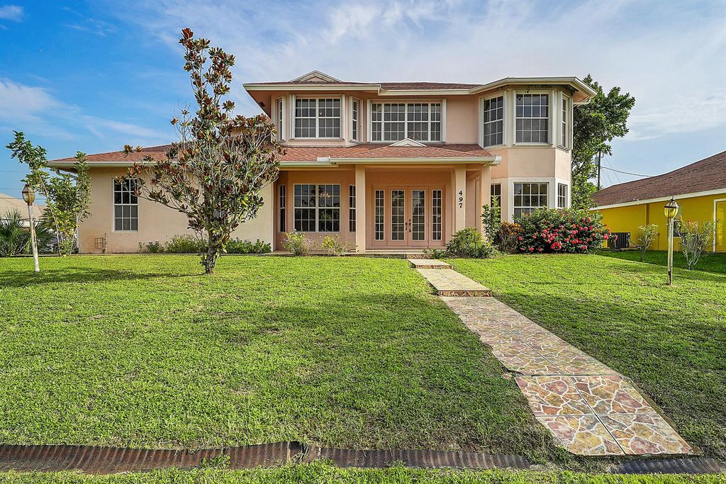 Photo of 497 SW Dagget Avenue, Port Saint Lucie, FL 34953 (MLS # R11014047)