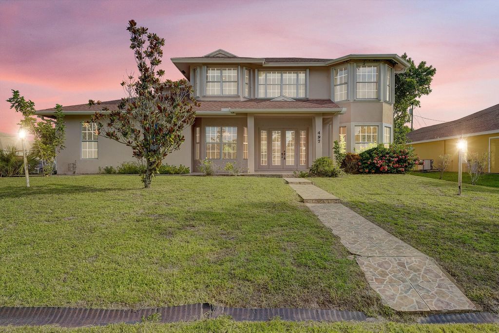 Photo of 497 SW Dagget Avenue, Port Saint Lucie, FL 34953 (MLS # R11014047)