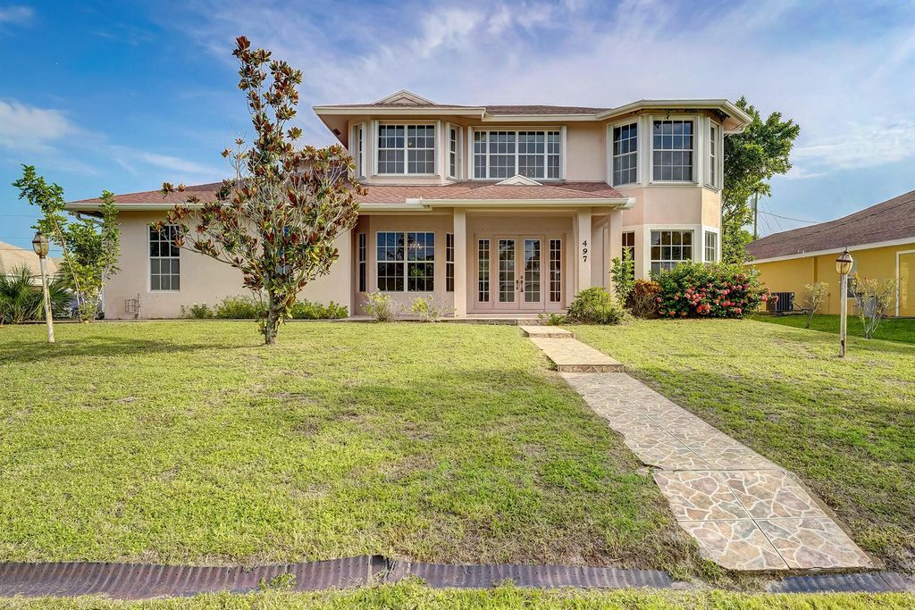 Photo of 497 SW Dagget Avenue, Port Saint Lucie, FL 34953 (MLS # R11014047)
