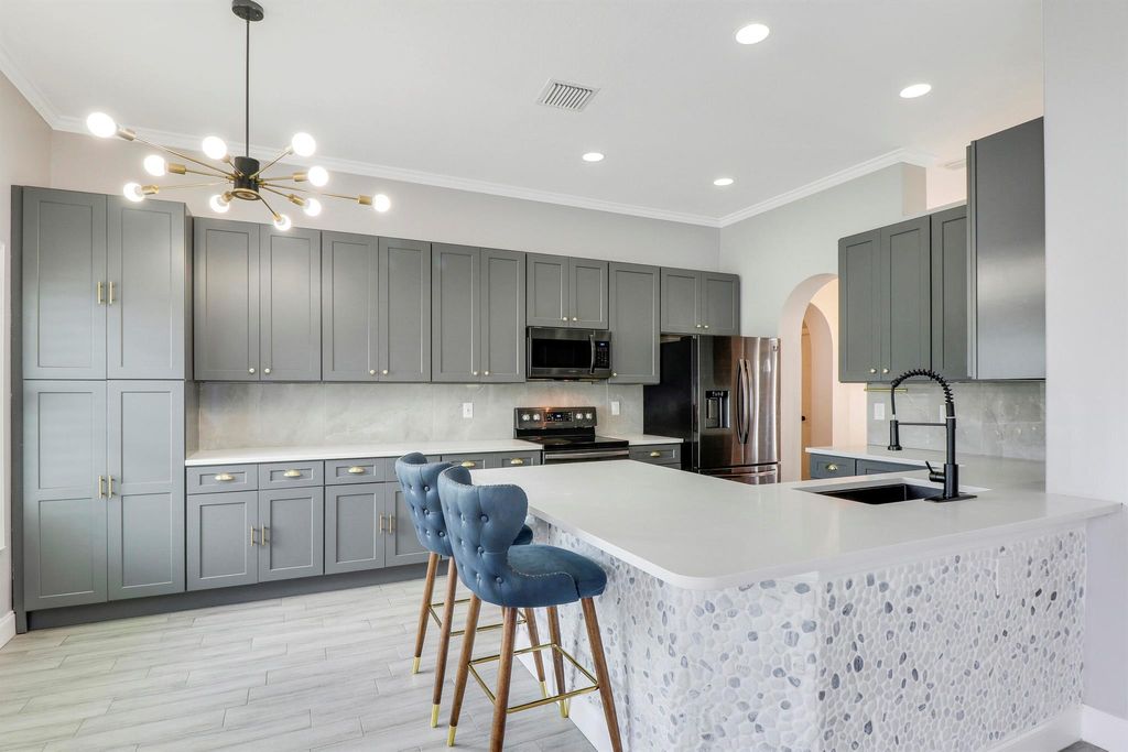 Photo of 1550 SW Iffla Avenue, Port Saint Lucie, FL 34953 (MLS # R10984514)