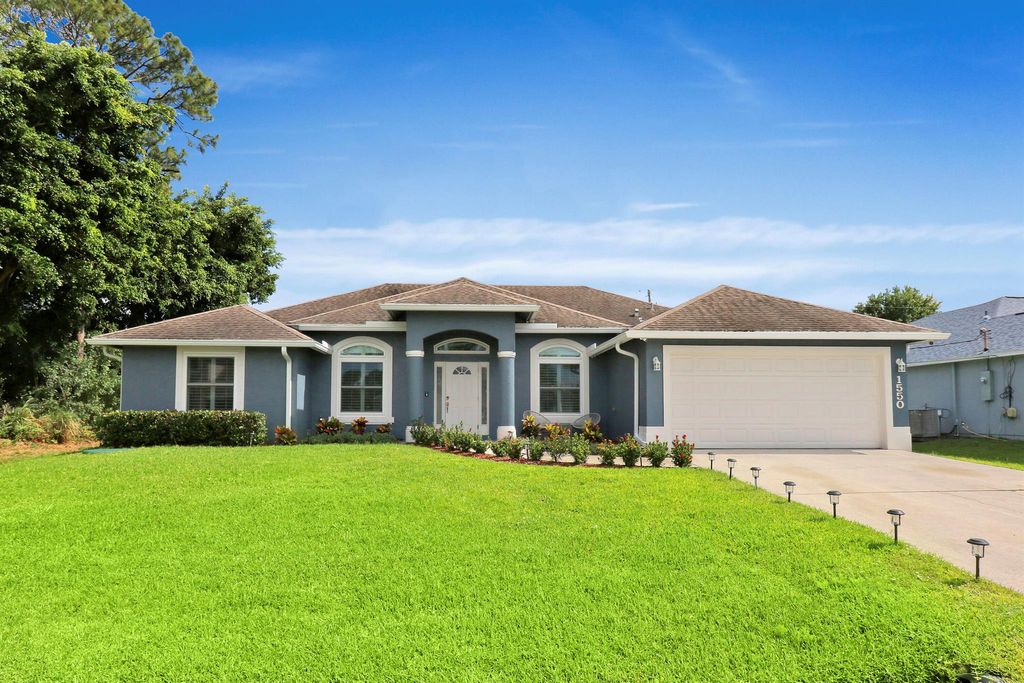 Photo of 1550 SW Iffla Avenue, Port Saint Lucie, FL 34953 (MLS # R10984514)