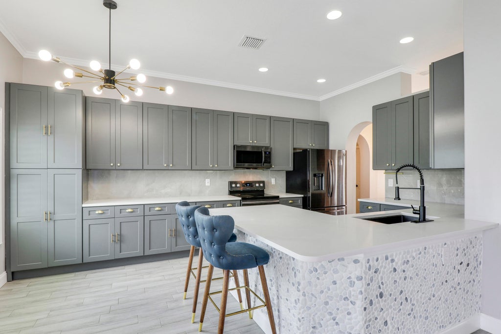 Photo of 1550 SW Iffla Avenue, Port Saint Lucie, FL 34953 (MLS # R10984514)