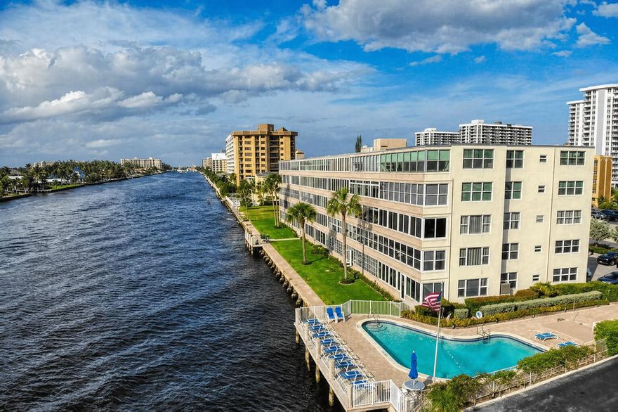 Upgraded corner unit in a charming boutique Intracoastal building! This bright and airy 2BR/2BA residence offers an open-concept layout and a stylish gourmet kitchen with a center island, snack bar, stainless steel appliances, granite countertops, and solid wood cabinets with pull-out drawers and a tumble marble backsplash. Features include central A/C, high-impact windows and doors, and a flexible second bedroom/den/office with a queen Murphy bed. The primary suite includes double closets for ample storage. Prime location within walking distance to Pompano Beach, the fishing pier, Beach House, and Oceanic—perfect for enjoying the area's vibrant coastal lifestyle. OWNER IS WILLING TO HOLD MORTGAGE.