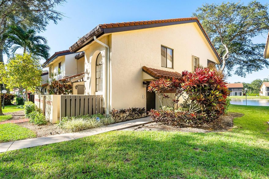 Lovely lakefront REMODELED corner unit in desirable 55+ Palm Chase Lakes. Steps to amenities and a SHORT walk to worship makes this one a must see! Move-in ready. Light, bright and open is what you immediately feel with the soaring ceilings and premium LAKE VIEW.  Wood plank laminate flooring throughout - no carpet! Kitchen has been thoughtfully upgraded with subway tile backsplash, granite counter tops, porcelain tile floors, newer appliances and BRAND NEW dishwasher. Eat-in breakfast area is the perfect place for coffee in the morning.  Great room is open to the kitchen and dining area allowing perfect entertaining flow. Enjoy the large screened-in lanai w/ remote, retractable blinds overlooking the glistening lake.