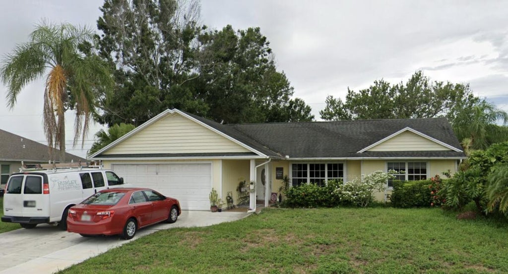 Photo of 6809 NW Dragon Street, Port Saint Lucie, FL 34983 (MLS # B26064562)