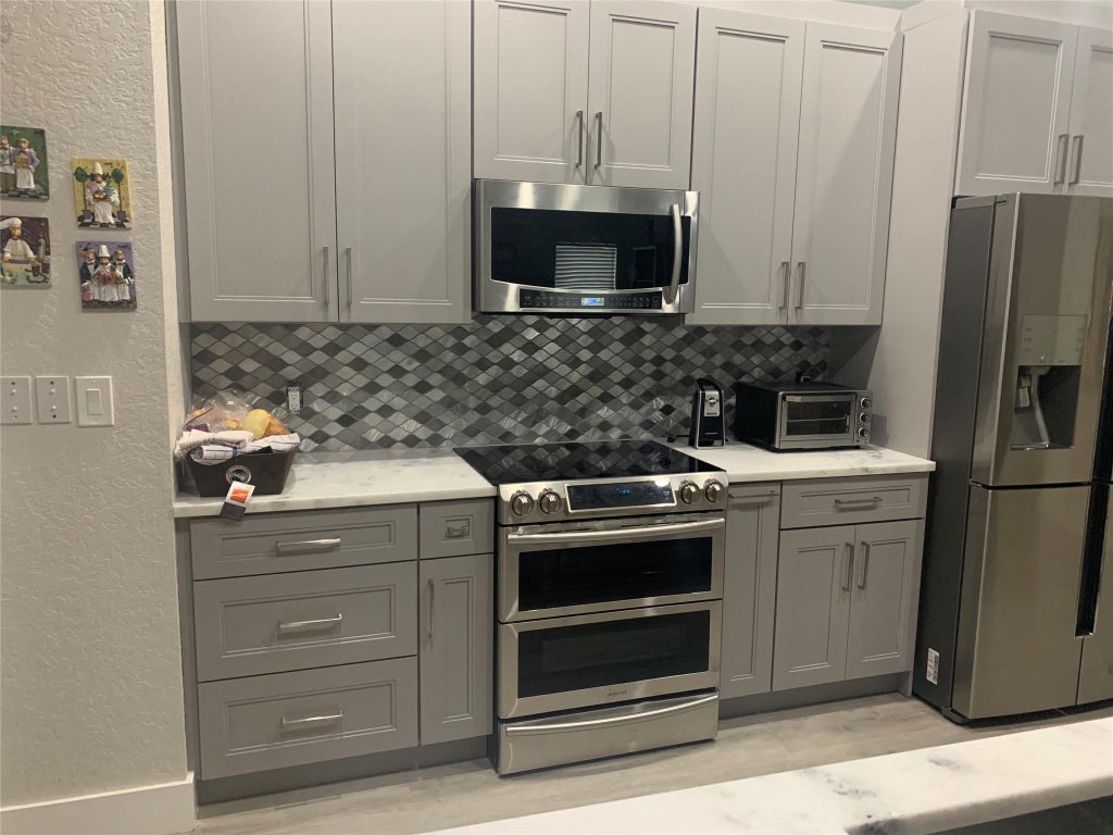 Photo of 5015 NW 104th Way, Coral Springs, FL 33076 (MLS # F10530780)