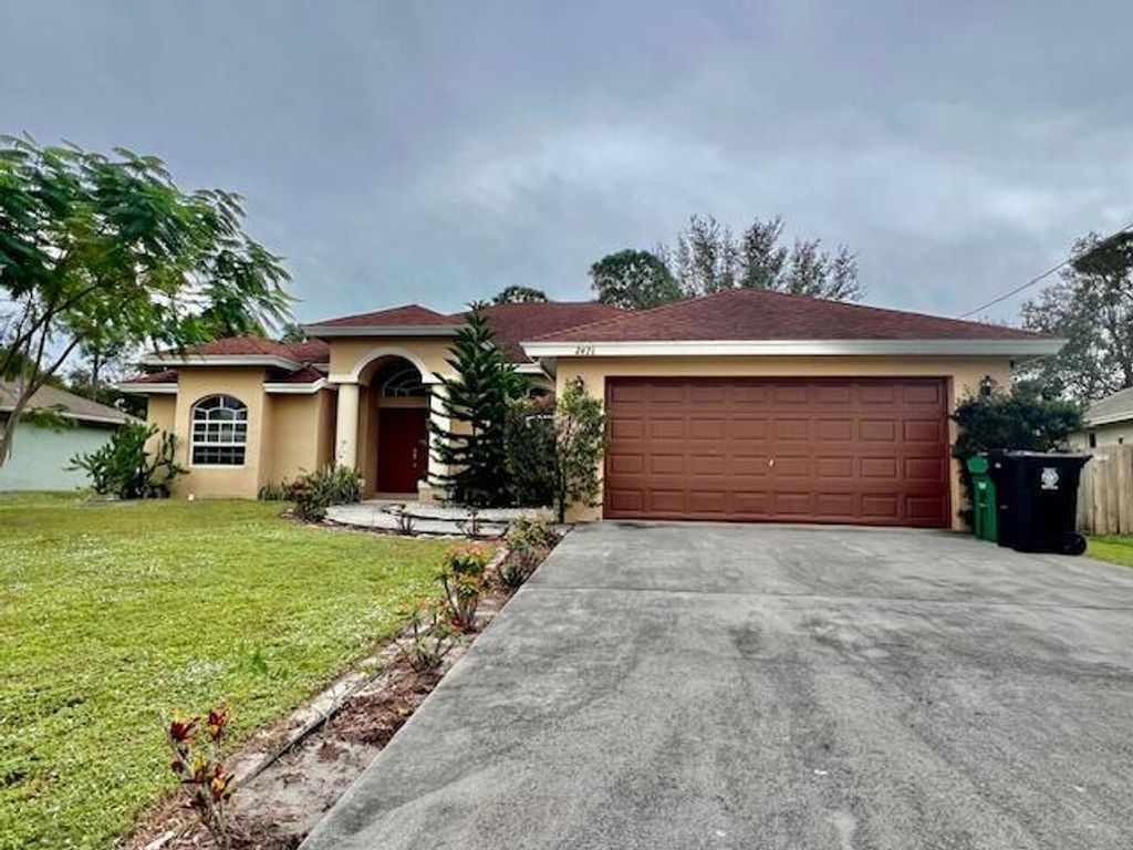 Photo of 2471 SW Madiera Street, Port Saint Lucie, FL 34953 (MLS # R11047135)