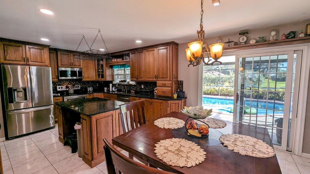 Photo of 2169 SE Dolphin Road, Port Saint Lucie, FL 34952 (MLS # R11039891)