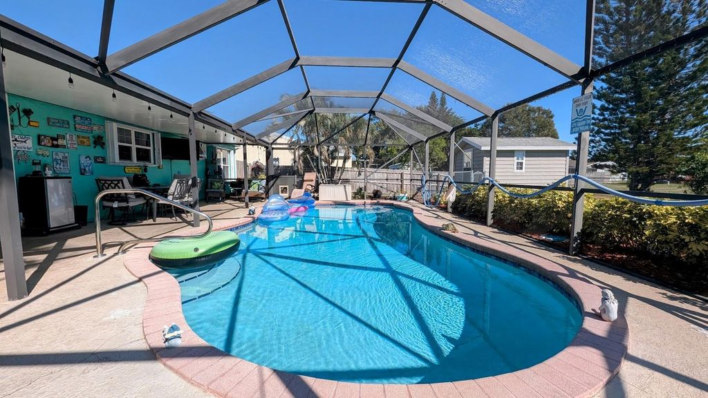 Photo of 2169 SE Dolphin Road, Port Saint Lucie, FL 34952 (MLS # R11039891)