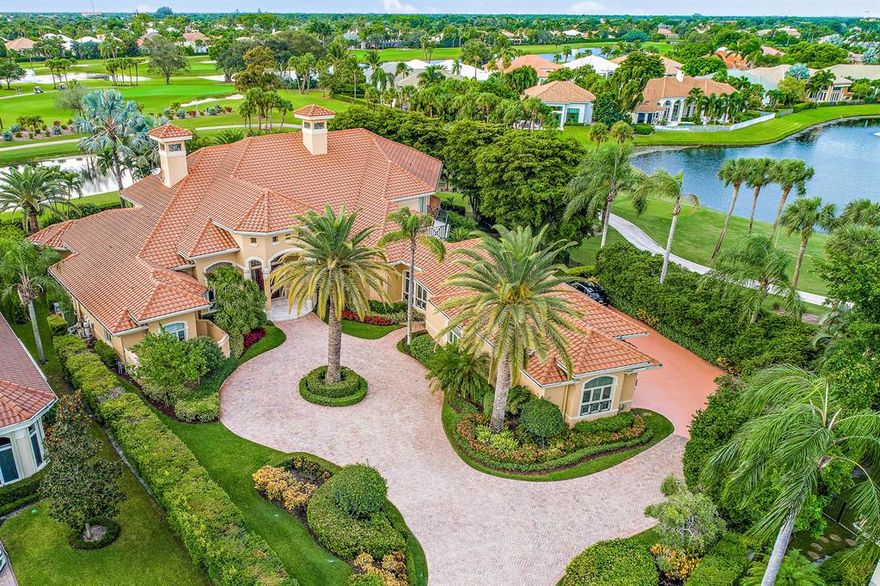 First time on the market: An exquisite, updated custom modern-classic estate home nestled in the exclusive St. Thomas enclave of BallenIsles. Privacy abounds in this 5 bedroom with en-suite baths and 2 half baths home with its secluded cul-de-sac lot (over .60 acre) featuring panoramic golf course and lake views, and grand driveway and parking area with rear-entry 3 car (plus golf cart) garage access complete with storage galore and a rare walk-up attic. This impeccable 7,220 sq. ft home (10,351 under roof) features crown moulding throughout, with designer touches that invite luxurious living with surprisingly intimate spaces! See Supplemental...