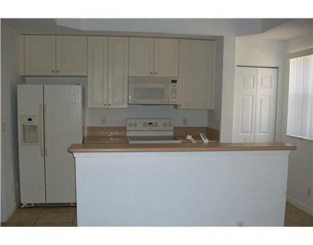 Photo of 2928 Hidden Hills Road #1403, West Palm Beach, FL 33411 (MLS # R11159848)