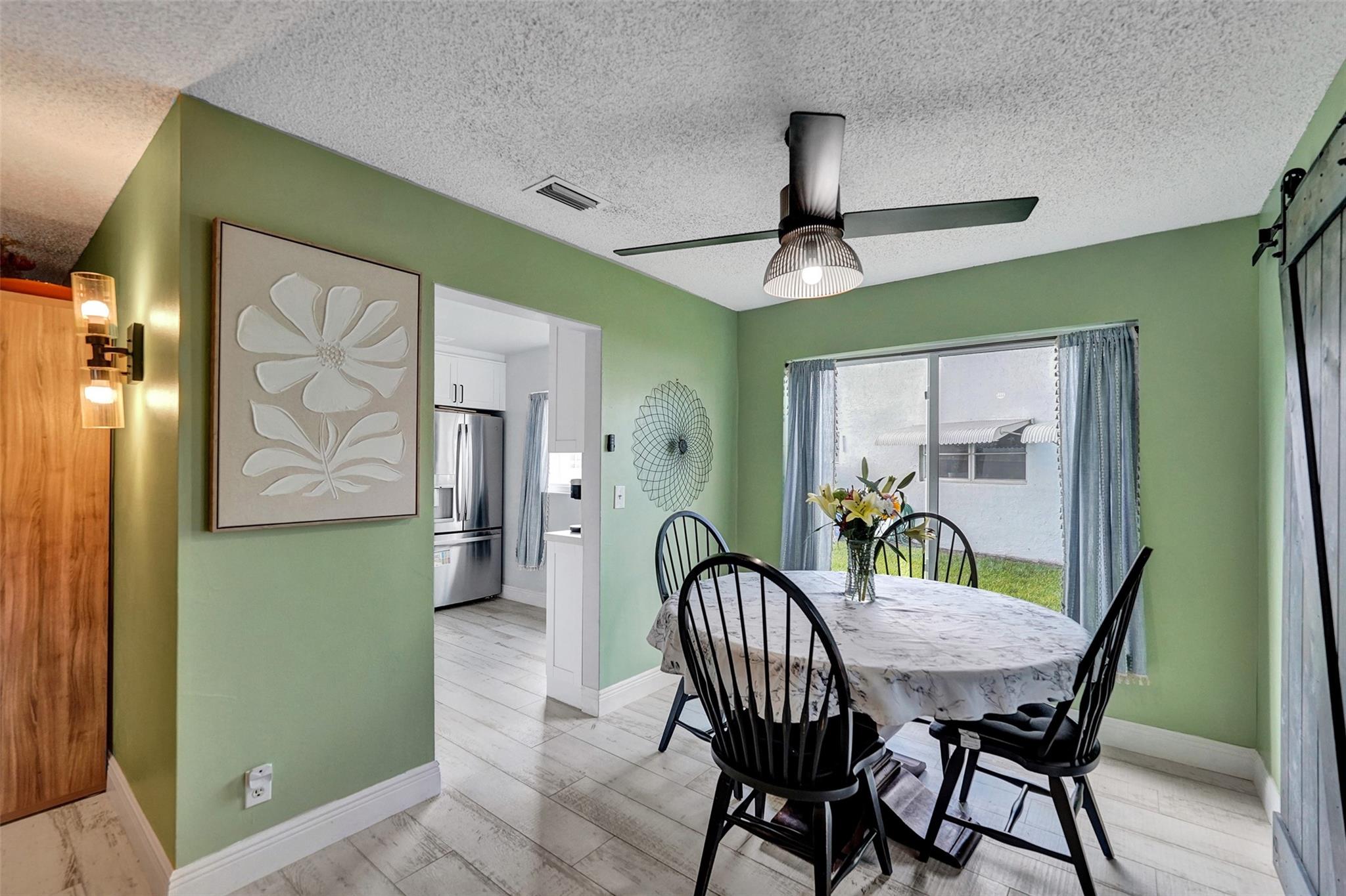 IMPACT WINDOWS AND DOORS. New Roof! 1114 Square Feet. Two Bedrooms PLUS a Den that can be a Third Bedroom. Updated Kitchen. Quiet Street. Move-in ready corner unit in a centrally located 55+ community! This 2-bedroom, 2-bath home features a versatile flex room—perfect as an office, gym, or extra bedroom. Enjoy peace of mind with impact windows, A/C replaced in 2022, and roof in 2017. The updated kitchen offers ample cabinet and counter space plus a pantry. HOA includes internet, cable, exterior paint, lawn care, and roof repair/replacement. Resort-style amenities include clubhouse, gym, workshop, pools, tennis courts, billiards, live entertainment, and free courtesy bus. Low monthly fees with full reserves make this a fantastic opportunity!