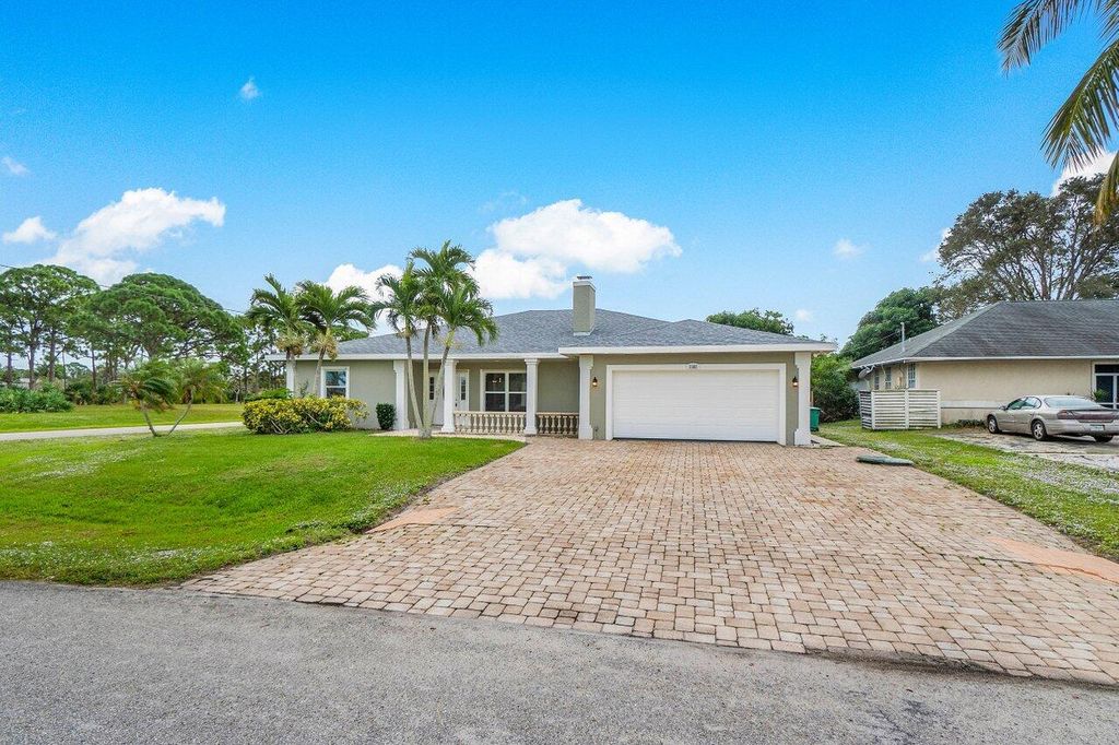Photo of 2302 SE Calcutta Circle, Port Saint Lucie, FL 34952 (MLS # R10970317)