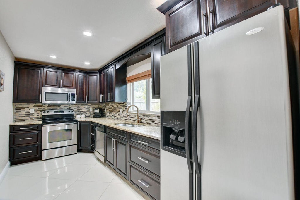 Photo of 1371 Woodcrest Road #B, West Palm Beach, FL 33417 (MLS # R11137057)